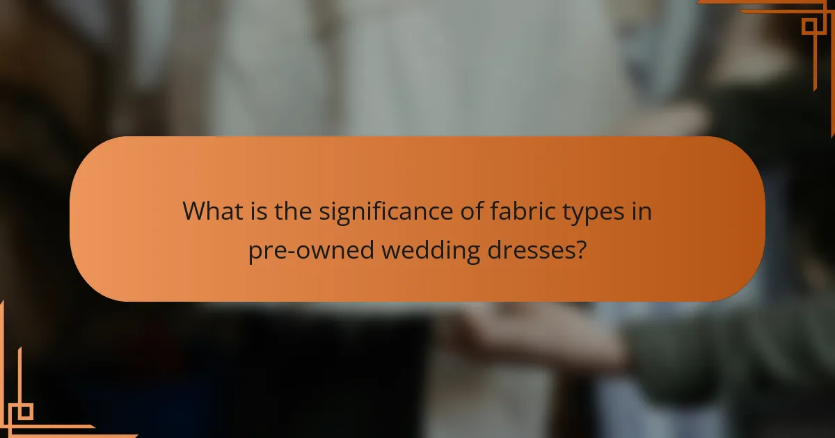 What is the significance of fabric types in pre-owned wedding dresses?